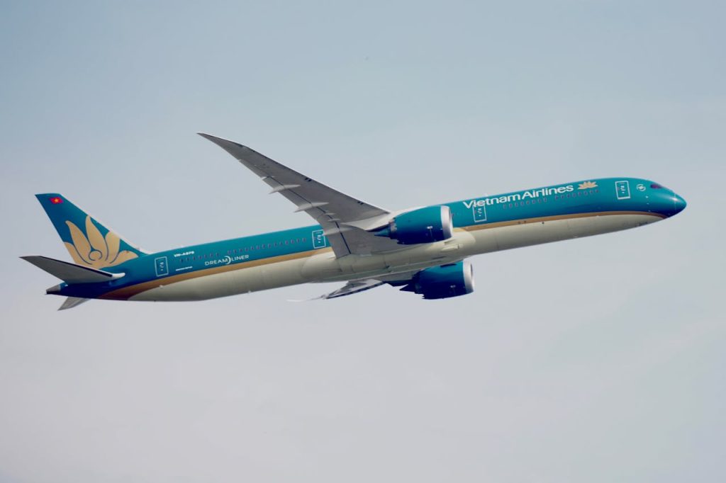 Vietnam Airlines Boeing 787 Dreamliner jet soaring through clear skies, showcasing aviation excellence.